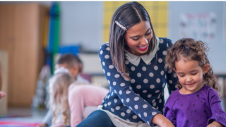  Adult with Child in classroom 