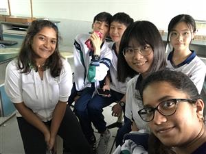 Ananya attending school with a group of her Chinese friends 