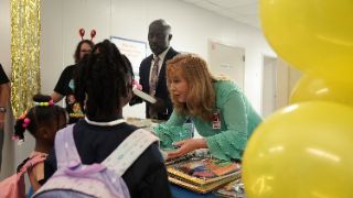  handing out supplies