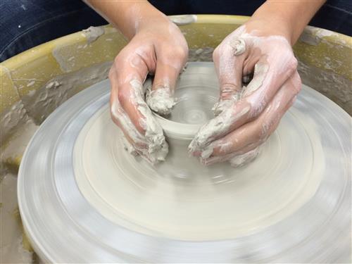 Throwing Clay on Wheel 